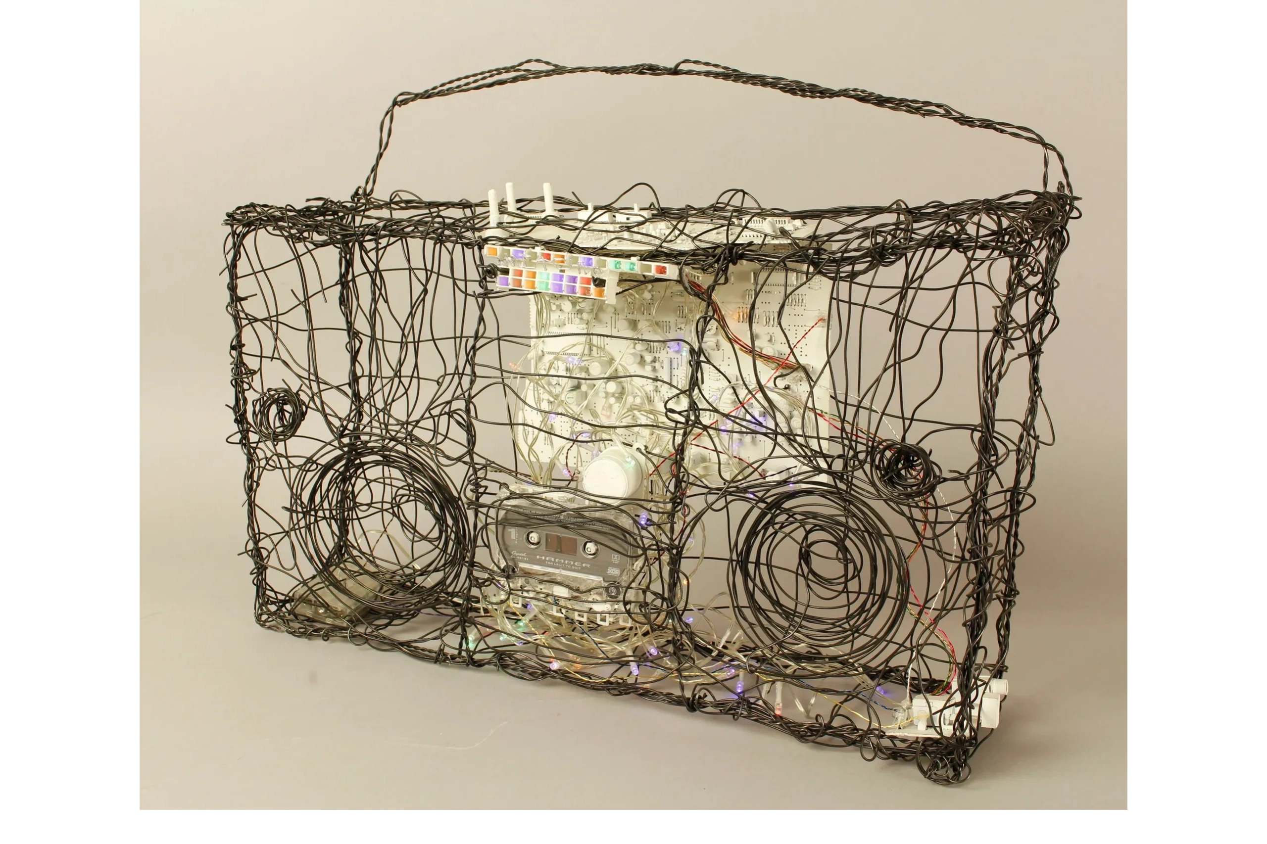 Boombox
2020
18 x 23.5 x 5.5"
Wire, string lights, cassette, and stereo components