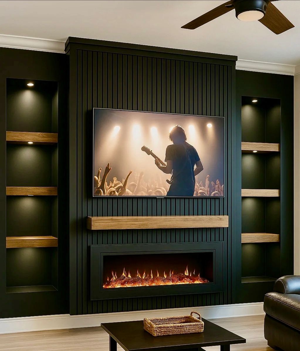 Modern living room with media wall buildout with warm lighting, a large TV, with fireplace and shelving on the side.
