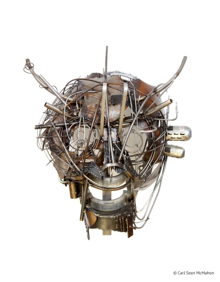 20th Century Man mask with asymmetrical design and patinaed steel, showing visible found components