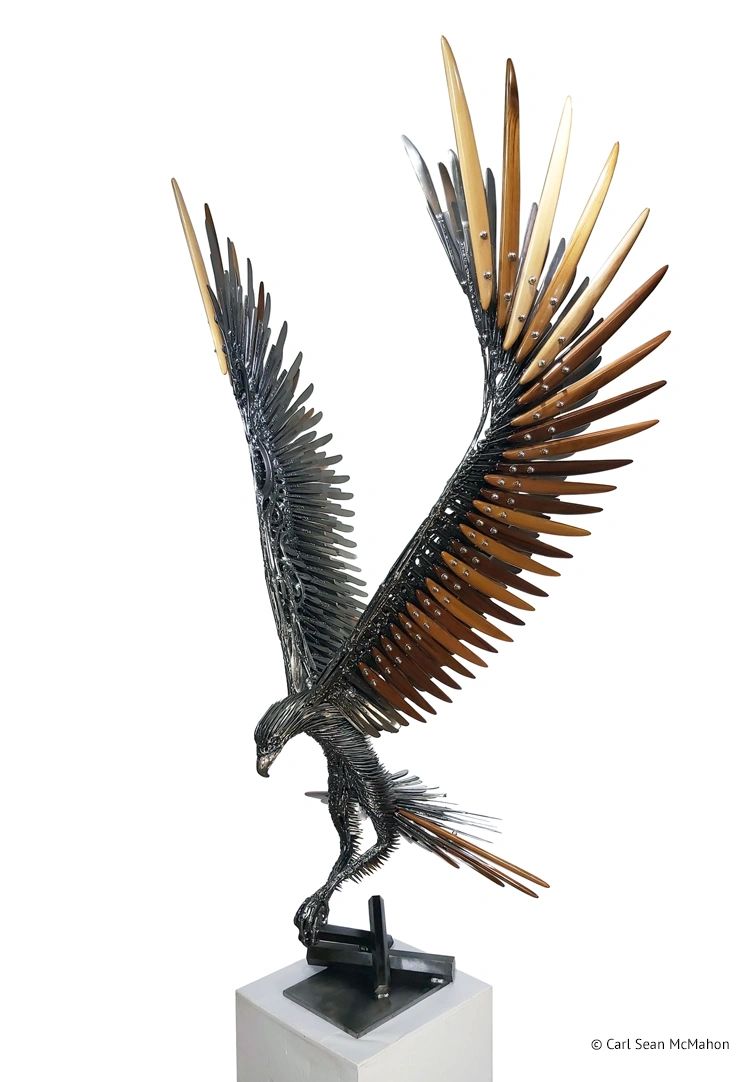 Large indoor eagle sculpture with upward wings and cedar color gradient, front-left perspective view