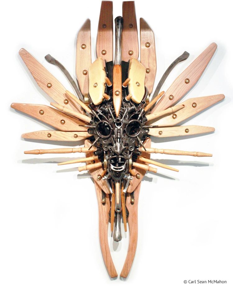 Nexus mask with elongated form, hollow eyes, and minimal structure with oak and pine throughout