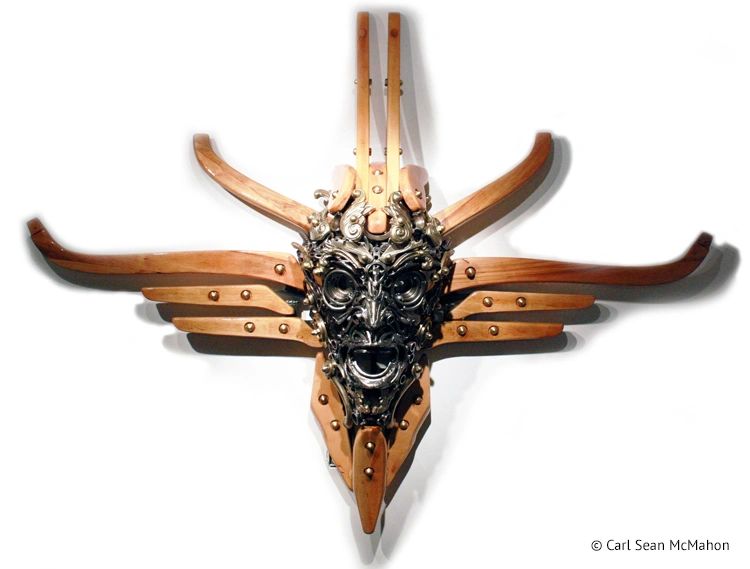 Nexus II mask sculpture with bold cross form in reclaimed steel, pine chair parts, and brass detail