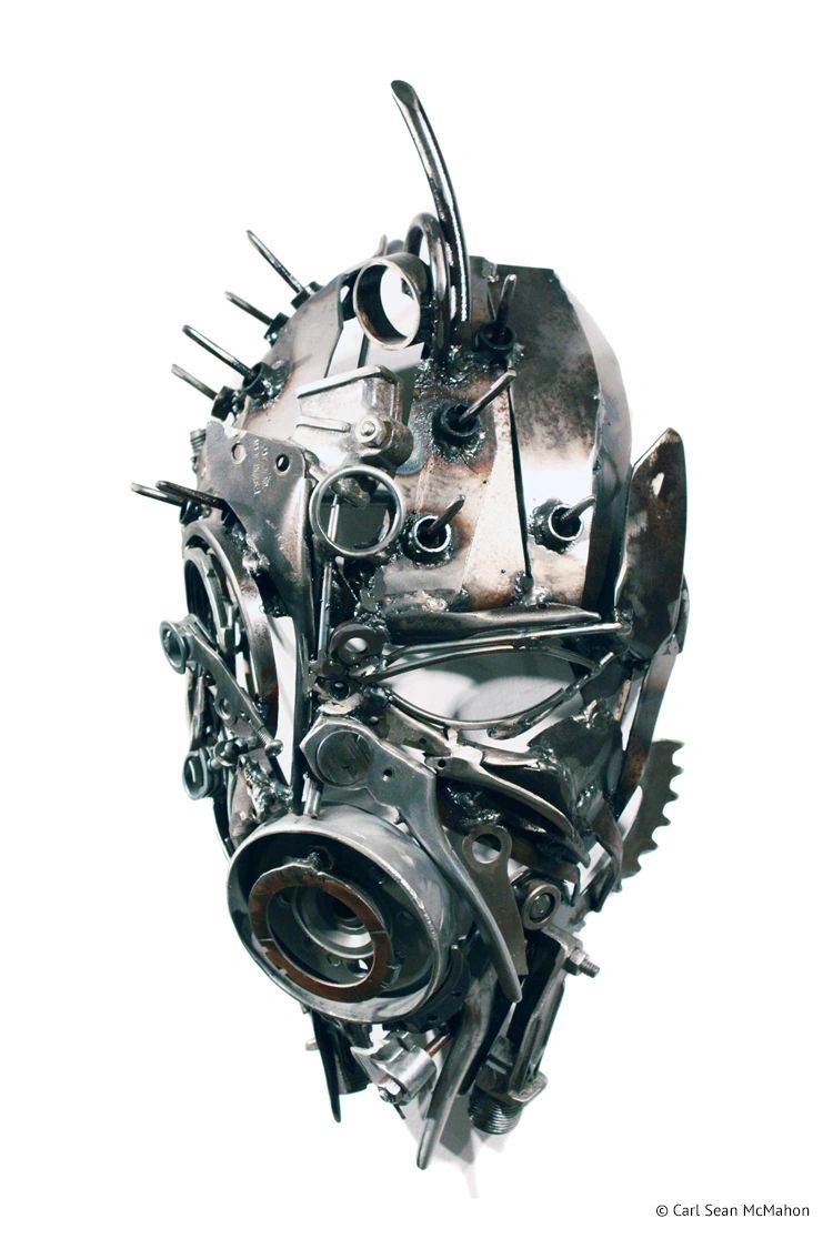 eft view of PA Mask with steel face, angular form, and sharp forehead spikes from reclaimed metal