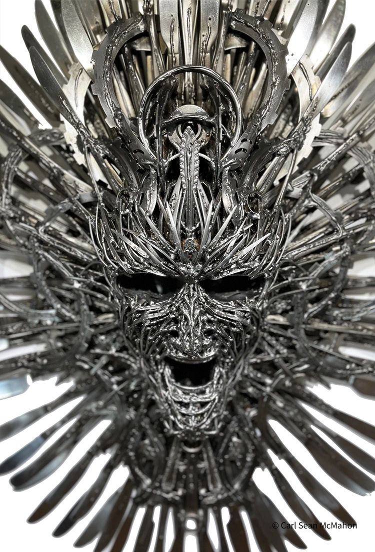 Close-up of Untitled Mask II showing layered transmission gears and cutlery in a dense metal design
