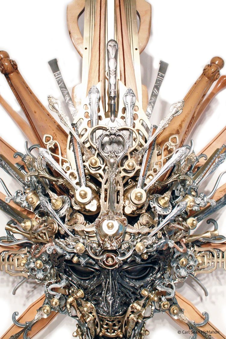 Detail of Nexus IV mask showing layered candleholder brass, chair leg carving, and aluminum trim