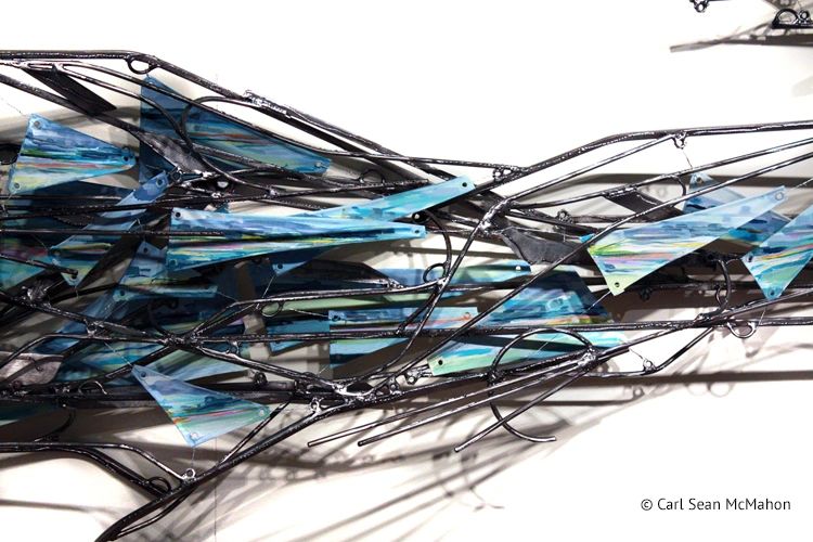 Mixed media coastal scene with layered bluish tones and sculpted island-like shapes