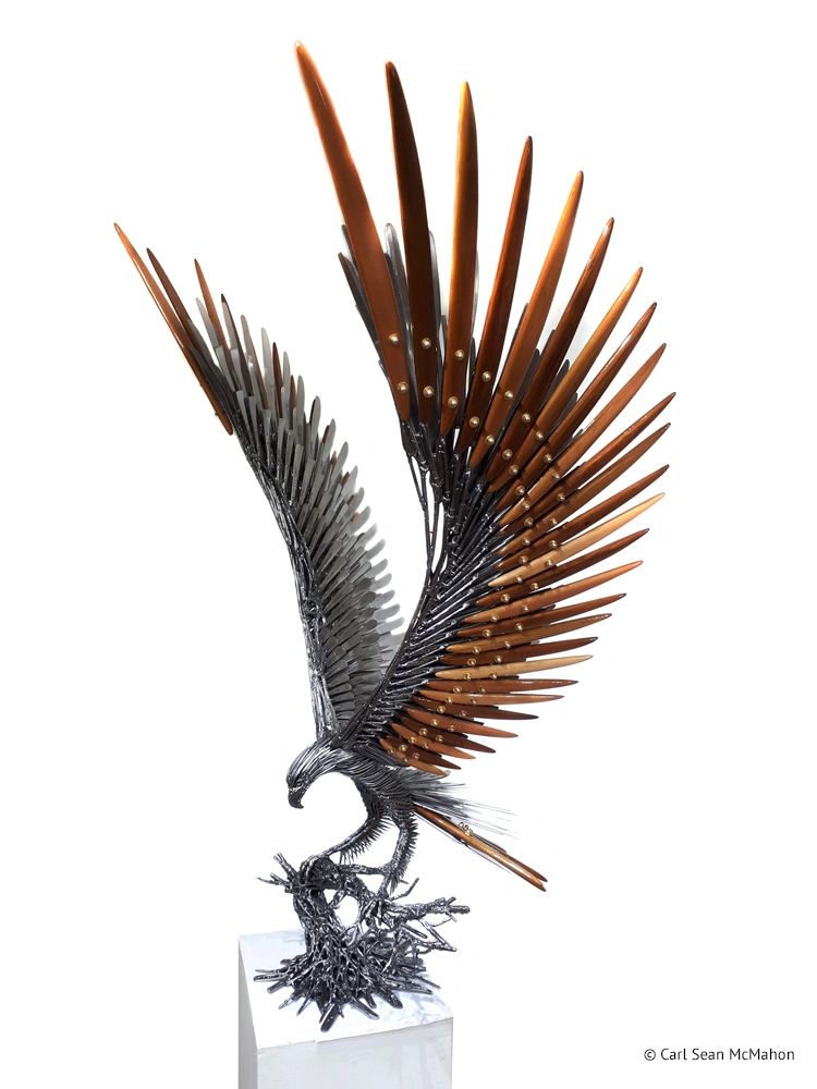 Eagle sculpture landing on metal tree, crafted with layered cedar and reclaimed steel elements