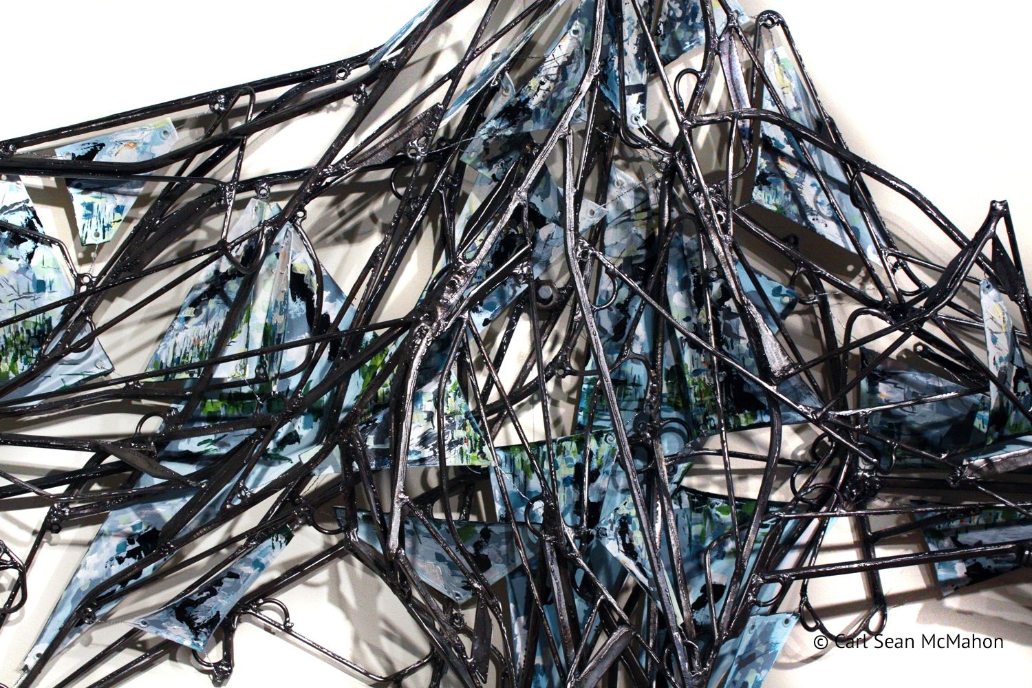 Mixed media sculpture of Northern B.C. with lake reflections and elevated mountain forms