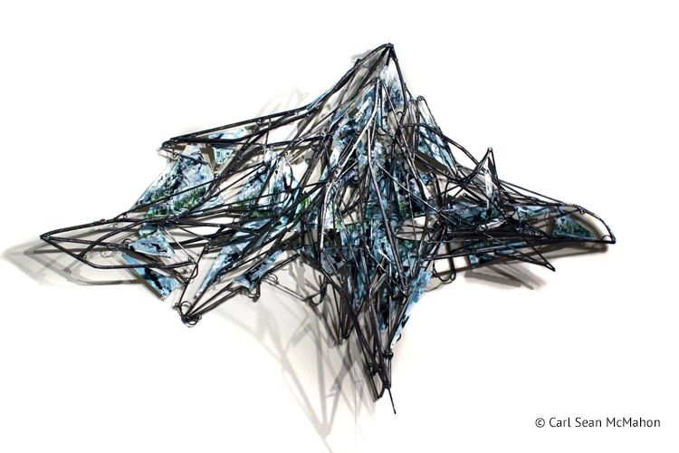 Sculptural painting of Northern B.C. with mountains and lake reflections in layered relief