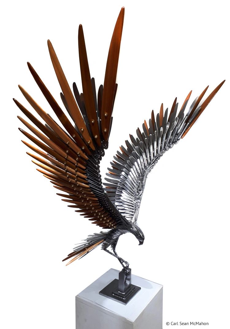 Steel osprey sculpture with cedar feathering, perched on a rectangular base with tapered cutout