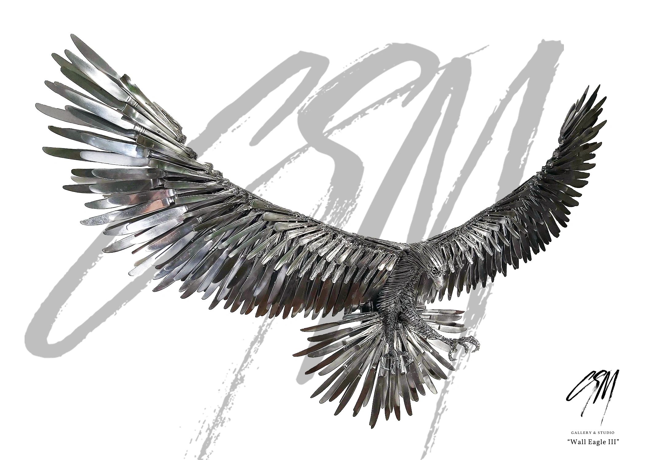 Front-right view of compact wall-mounted eagle sculpture made from repurposed steel and metal.