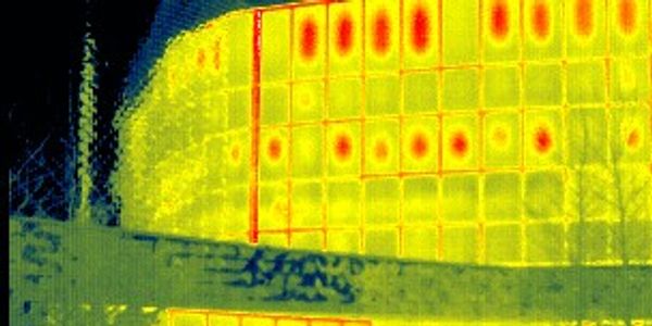 Thermal image of a building envelope showing heat loss.