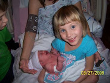 Rachel holding her brand new baby sister!