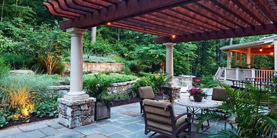 natural stone columns and patio area with fireplace
