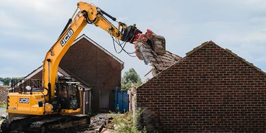 demolition and disposal of a brick structure and garage 