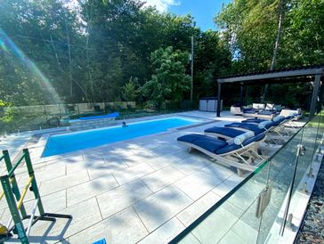 fibreglass pool and techo bloc patio installed in st lazare quebec