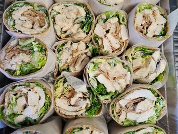 Tray of grilled chicken caesar wraps.