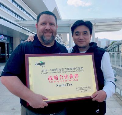 Todd Thurman receiving a strategic partnership award from Cargill China.