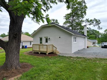 Modern deck installation and lush landscaping for a home