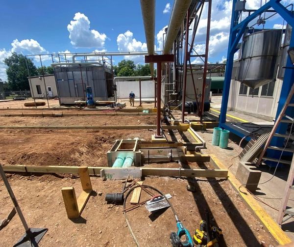 New concrete being poured at the plant to expand facility