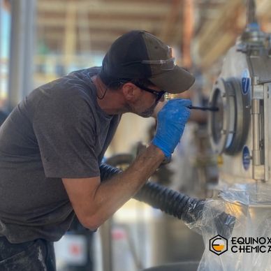 The owner inspecting one of the tanks