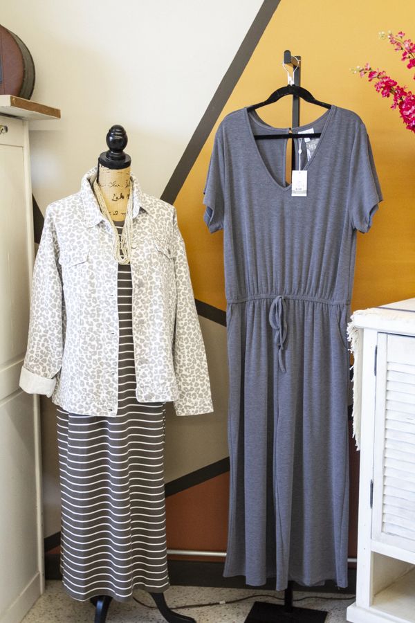 Two blue dresses,one with stripes and a jacket,the other short sleeved with a drawstring waist.