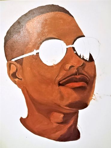 Portrait of man wearing a white t-shirt, with large sunglasses.