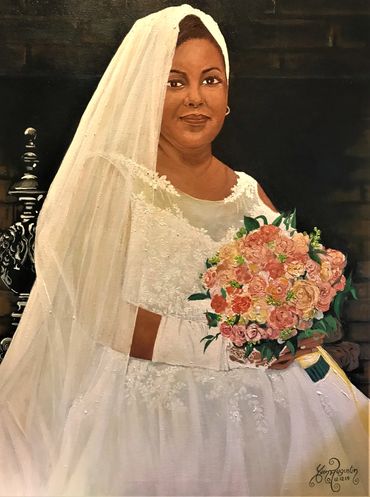 Portrait of woman in her wedding dress holding a bouquet of colorful flowers.