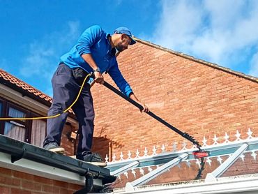 Conservatory window cleaning with extendable pole in Hanwell.