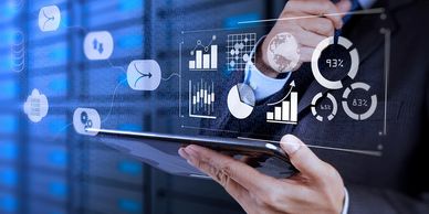 Finger touching transparent data screen with charts showing democratisation of data