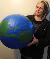 teacher with giant planet for science week 2020