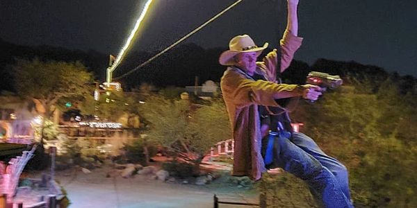 Shooting to get a perfect score on Outlaw Zip Line in Old Tucson.