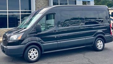 15 passenger seating
Black exterior
