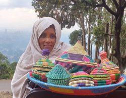 Woman selling hand woven baskets in Addis Ababa Ethiopia