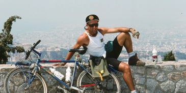 Chris Dalton with bicycle on Lycabettus Hill, Athens