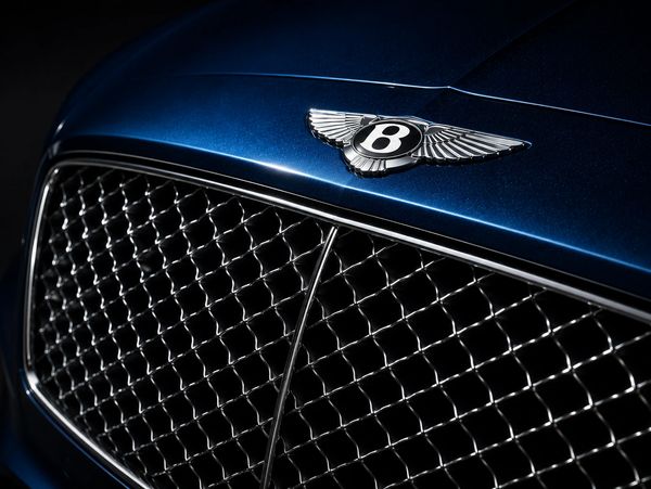 Close-up of the Bentley wings badge and grille on a luxury performance car featured by LEBOR Performance Cars.