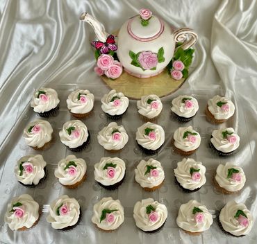 Teapot shower cake with handmade pink rosebud cupcakes
