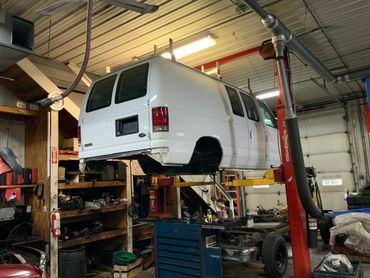 Service Van on vehicle lift - North County Service Center - Manchester, Maryland