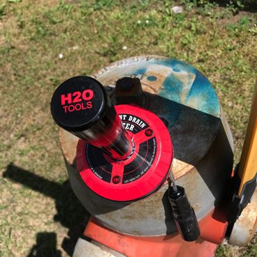 Hydrant Drain Meter HYD-10, attached to hydrant at an angle with Magnet base.