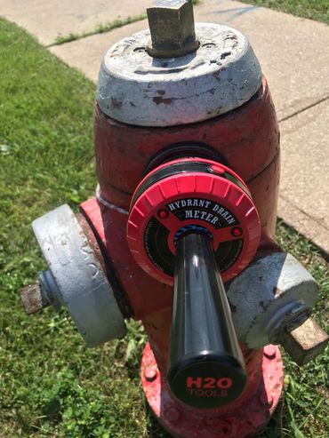 Hydrant Drain Meter, attached to hydrant at an angle with Magnet base.