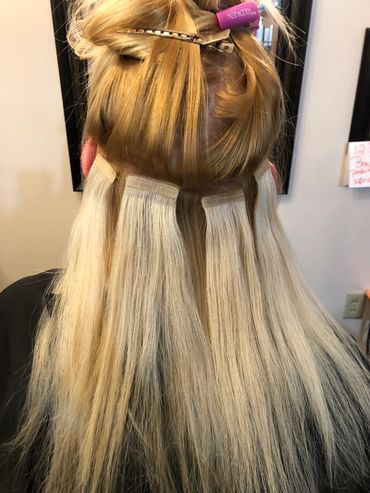 Tape in hair extensions applicatin