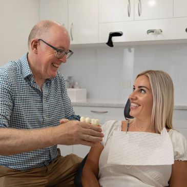 Dentist in surgery with patient 