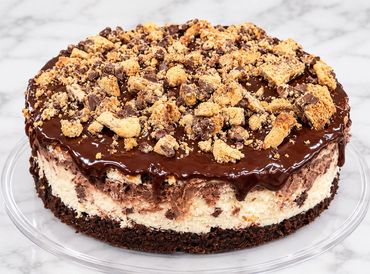Chocolate cheesecake topped with crunchy cookie pieces.