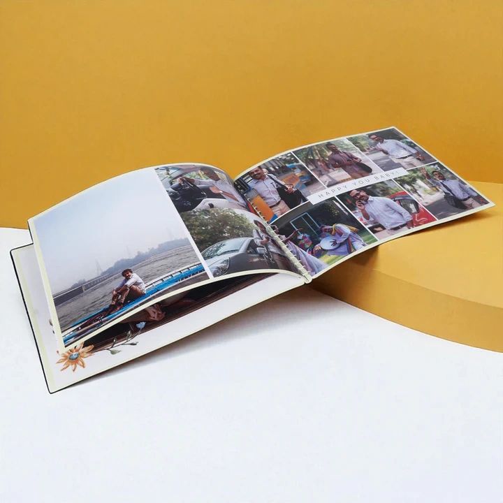 Open photo album displaying various personal pictures on a yellow and white background.