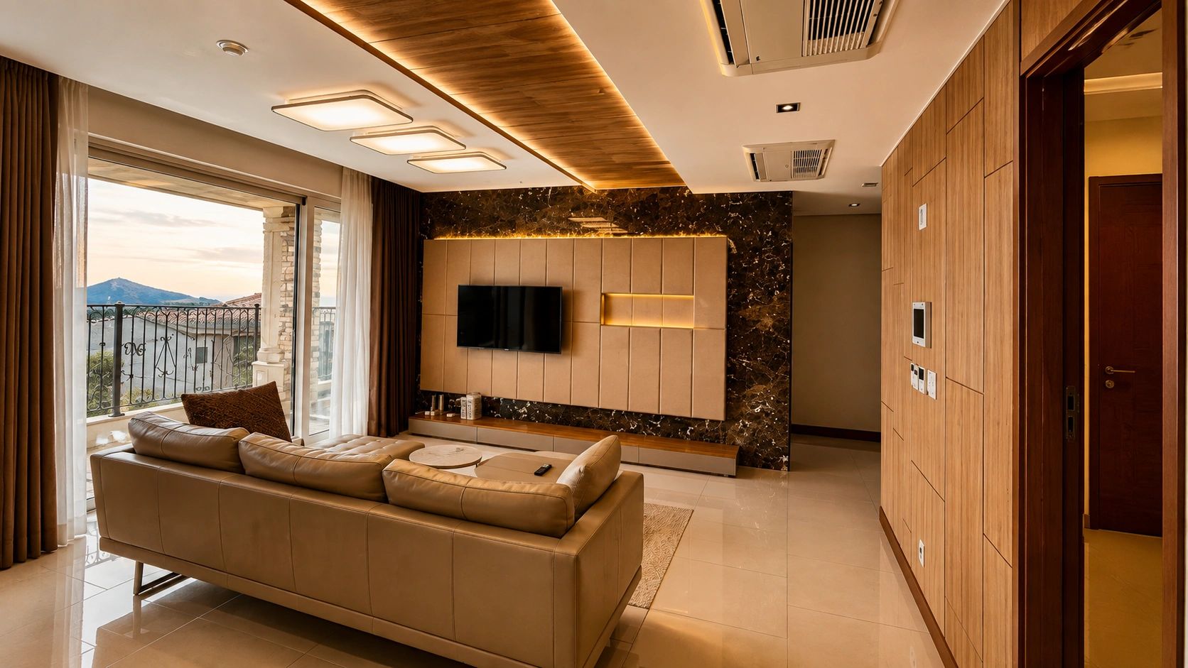 Modern living room with beige sofa and wall-mounted TV.