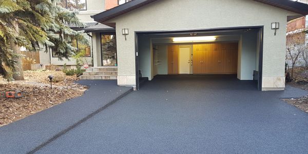 A driveway that has been resurfaced with rubber paving.