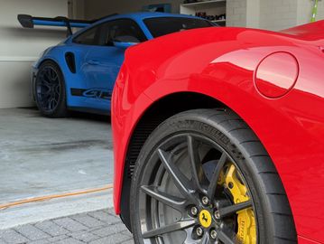 Both cars which are ceramic coated have just received a maintenance wash after a track day.