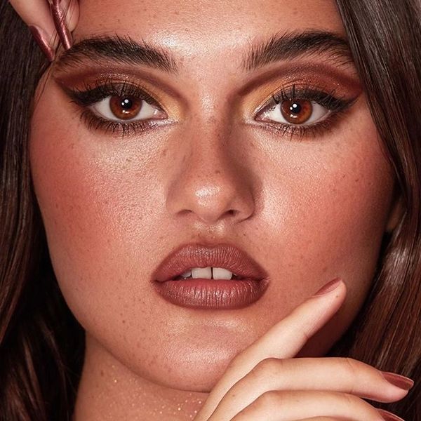 retro modern eyeliner in brown and black on female asian pacific model with brown skin tone