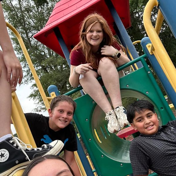 Kids having fun on a playground slide.
