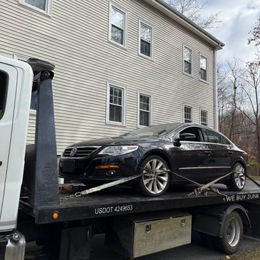 Junk 2010 VW CC on tow truck